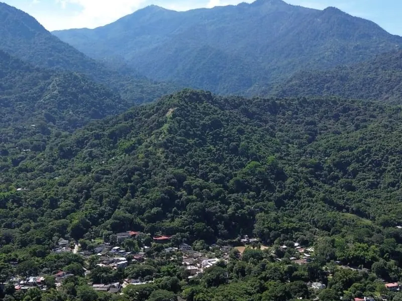 The village of Minca at the foot of forested mountains